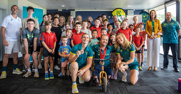 Andrew Liveris AO and Brisbane 2032 Olympic and Paralympic Games Organising Committee Board members, with Mayor Amy Eden, Paralympian Grant 'Scooter Patterson', Olympians Ellie Beers, Natalya Diehm and Mark Knowles, and children from the Cairns Athletics Association, Cairns Hockey Association and Cairns Volleyball Association.